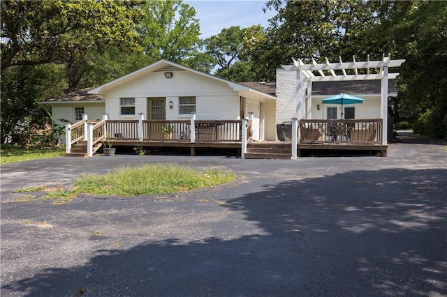 4689 Oak Ridge Rd, Mobile, AL 36609 - view of front of house featuring a wooden deck, a pergola, and board and batten siding