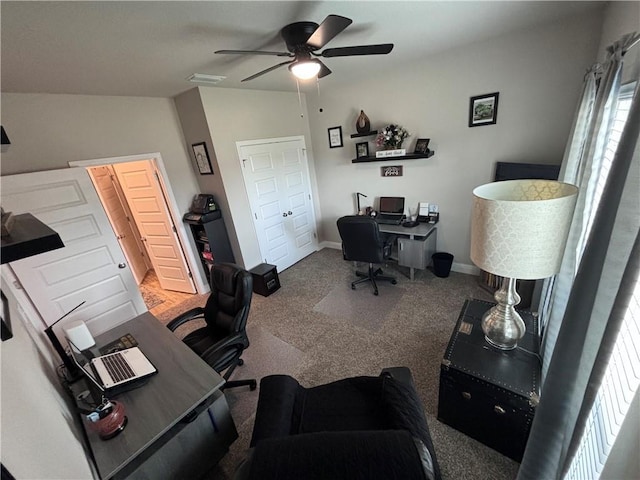office with carpet floors, a ceiling fan, visible vents, and baseboards