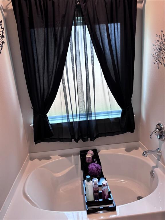 full bath with a bath