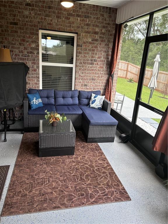 living area featuring speckled floor