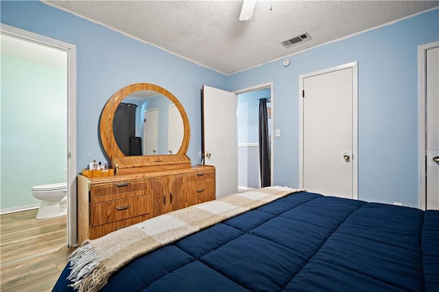 8920A Chunchula-Georgetown Rd, Chunchula, AL 36521 - bedroom featuring a textured ceiling, ceiling fan, wood finished floors, and visible vents