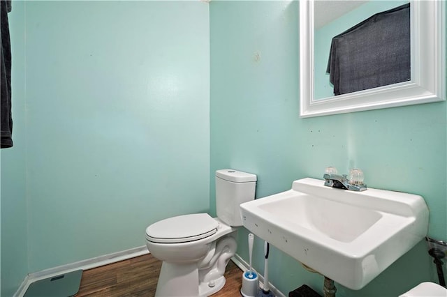 8920A Chunchula-Georgetown Rd, Chunchula, AL 36521 - half bathroom featuring baseboards, a sink, wood finished floors, and toilet