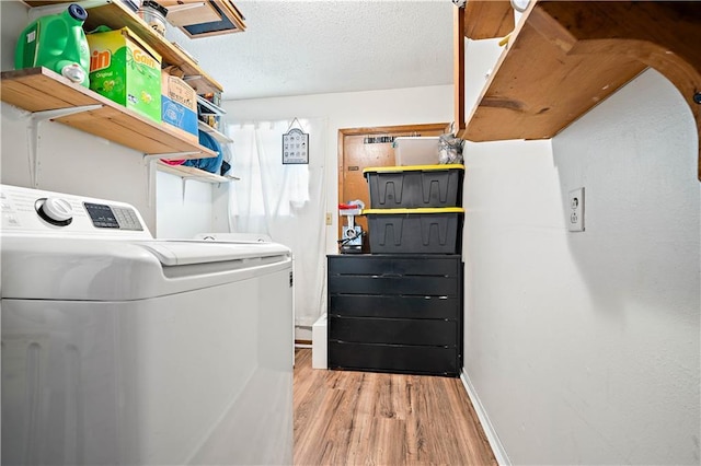 8920A Chunchula-Georgetown Rd, Chunchula, AL 36521 - washroom featuring baseboards, laundry area, light wood-style flooring, and washer and dryer