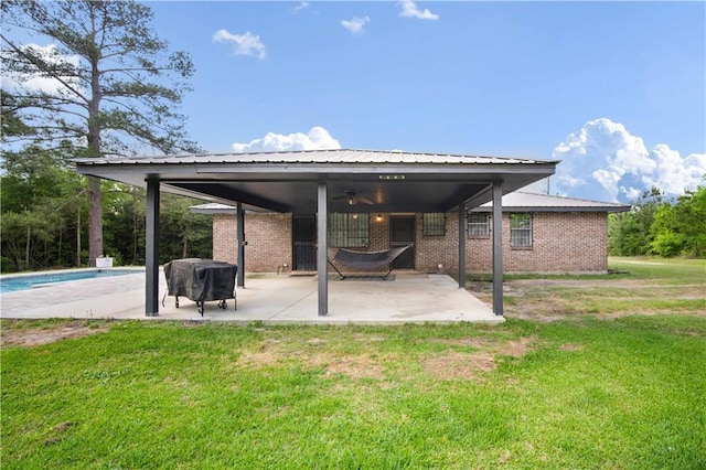 8920A Chunchula-Georgetown Rd, Chunchula, AL 36521 - view of patio / terrace with ceiling fan, an outdoor pool, and a grill