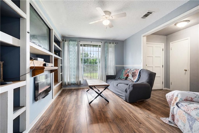 8920A Chunchula-Georgetown Rd, Chunchula, AL 36521 - living area featuring a ceiling fan, a textured ceiling, visible vents, and wood finished floors