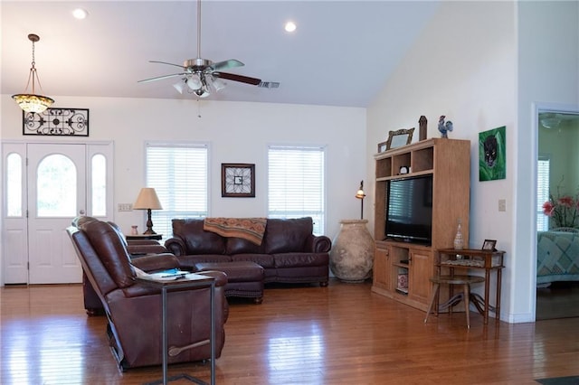 living room with vaulted ceiling, ceiling fan, and hardwood / wood-style flooring