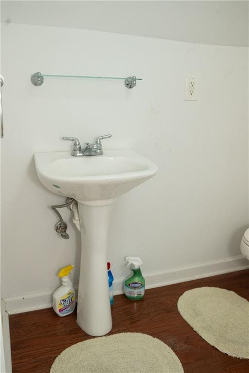 bathroom with hardwood / wood-style flooring