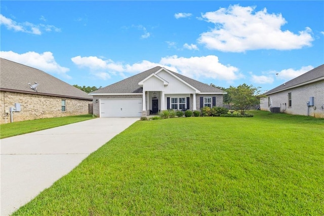 view of front facade featuring a garage, central AC unit, and a front lawn