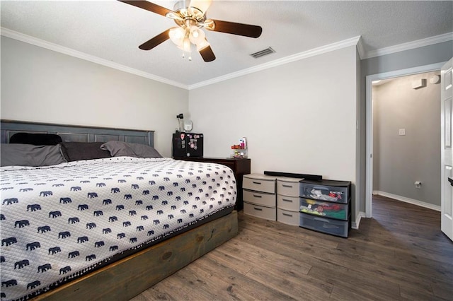 bedroom featuring baseboards, visible vents, ceiling fan, dark wood-type flooring, and crown molding