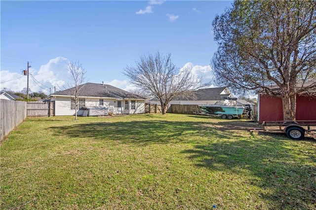 view of yard with a fenced backyard