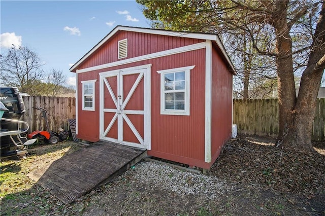 view of shed featuring a fenced backyard