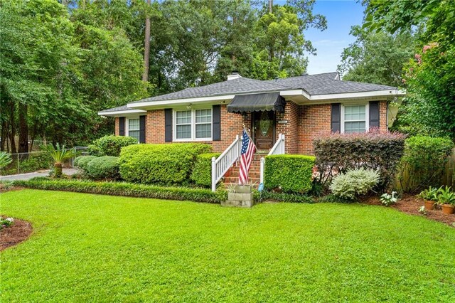 ranch-style house with a front yard