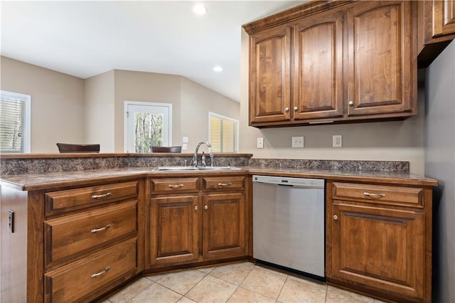 kitchen with dishwasher, refrigerator, light tile patterned flooring, and sink