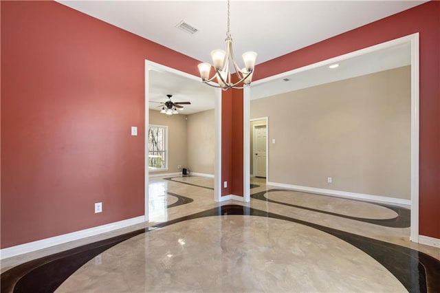 unfurnished dining area featuring ceiling fan with notable chandelier and concrete floors