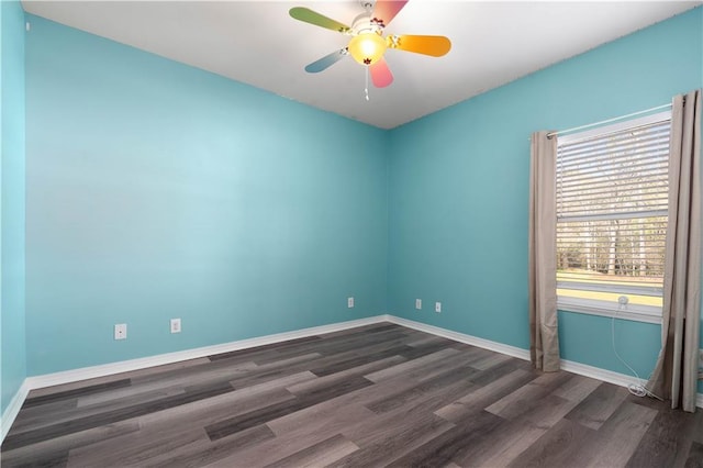 unfurnished room with ceiling fan and dark hardwood / wood-style floors