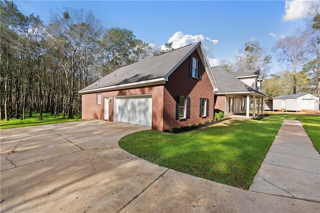 view of side of property with a garage and a yard