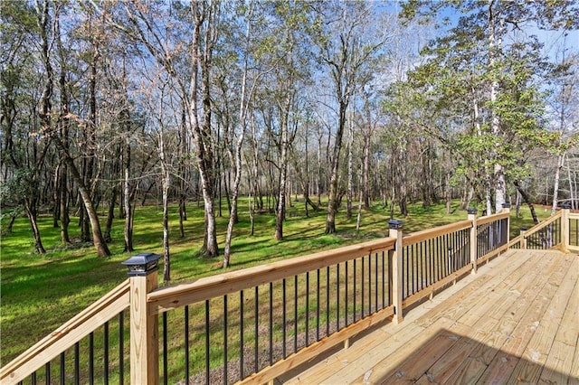 wooden deck featuring a yard