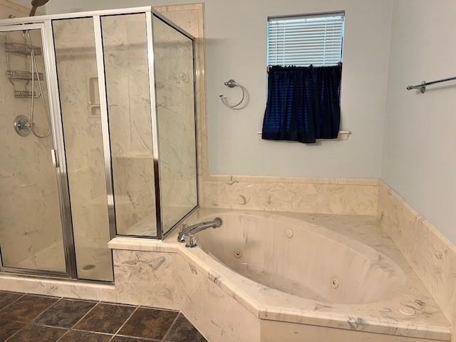 859 Cottage Hill Ave, Mobile, AL 36693 - bathroom featuring a whirlpool tub, a shower stall, and tile patterned floors