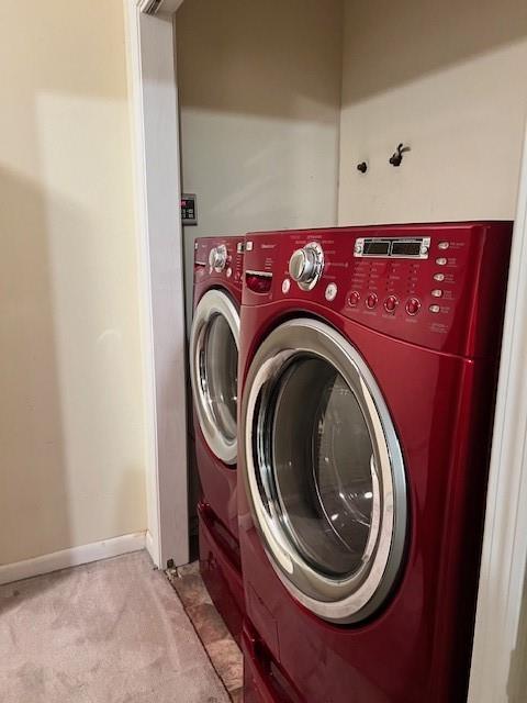 859 Cottage Hill Ave, Mobile, AL 36693 - laundry room featuring light carpet, independent washer and dryer, and baseboards