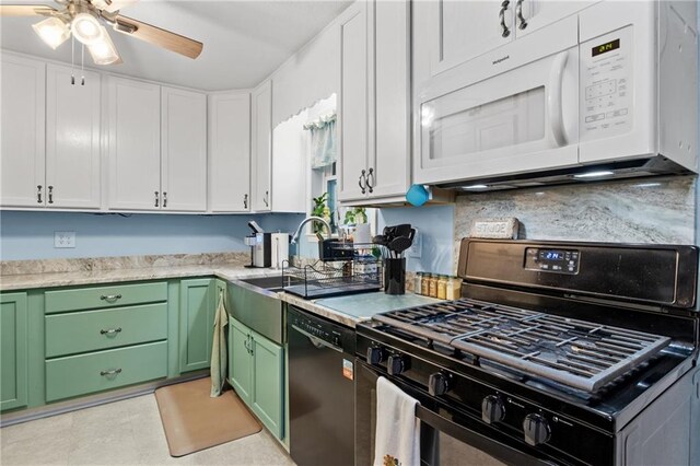 kitchen featuring green cabinetry, black appliances, decorative backsplash, and white cabinetry