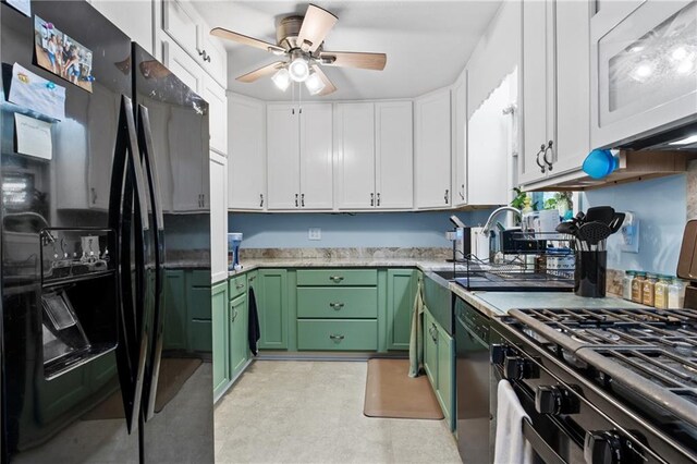 kitchen with black appliances, ceiling fan, green cabinets, and white cabinetry