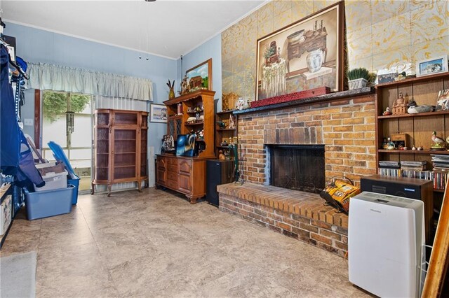 living room with a fireplace and ornamental molding