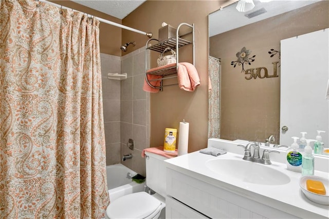 full bathroom with vanity, shower / bath combo with shower curtain, and toilet