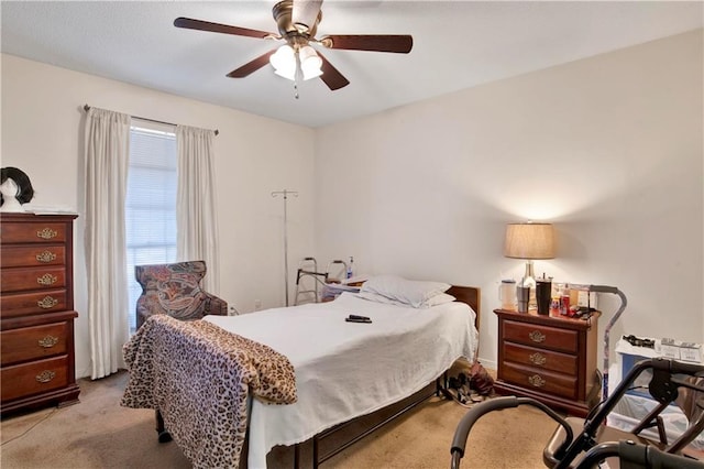 bedroom featuring light colored carpet and ceiling fan