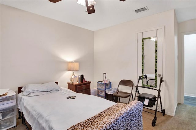 bedroom featuring ceiling fan and light carpet