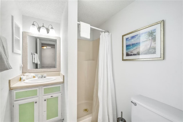 full bathroom with vanity, toilet, a textured ceiling, and shower / bath combo