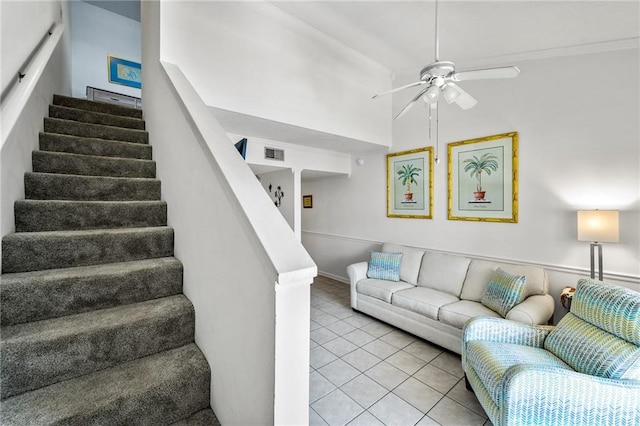 living room with ceiling fan and light tile patterned floors