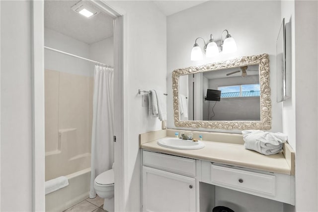 full bathroom featuring tile patterned flooring, shower / bath combo with shower curtain, ceiling fan, vanity, and toilet