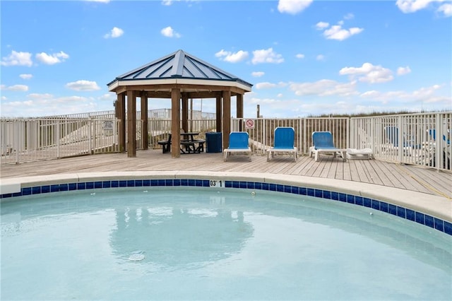 view of pool with a gazebo and a wooden deck