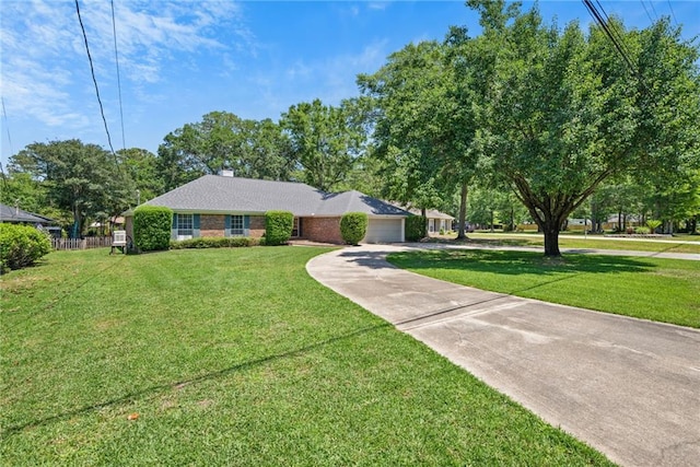ranch-style home with an attached garage, concrete driveway, brick siding, and a front yard