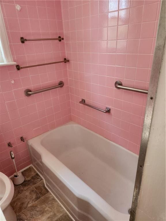 bathroom with plus walk in shower, tile patterned flooring, and toilet