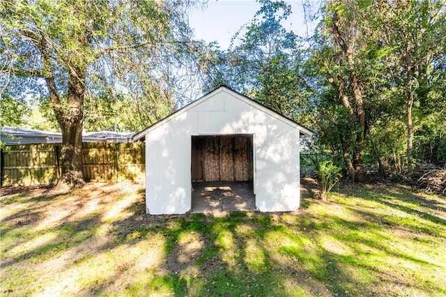 view of outdoor structure featuring a lawn