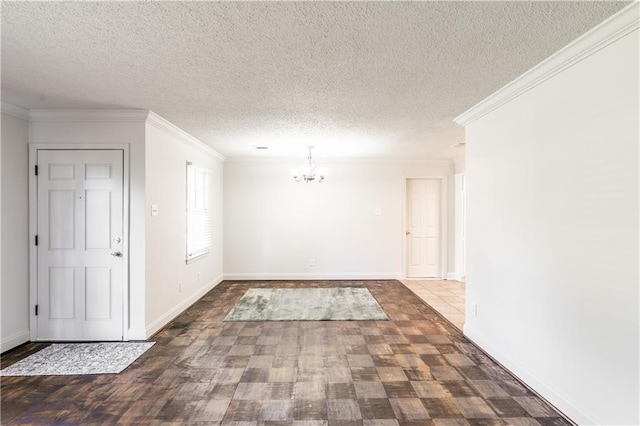 foyer with a textured ceiling, dark hardwood / wood-style flooring, and crown molding