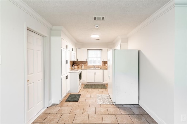 kitchen featuring white cabinetry, sink, backsplash, crown molding, and white appliances