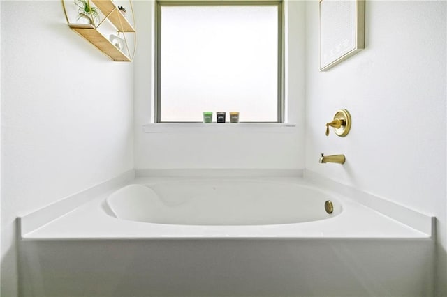 bathroom with a garden tub