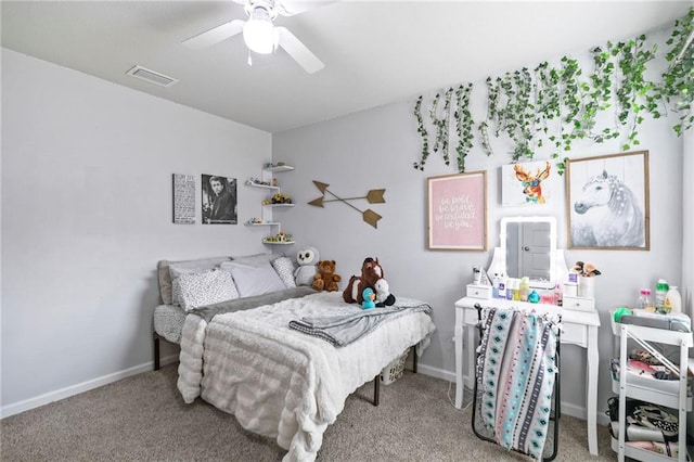 carpeted bedroom with baseboards, visible vents, and ceiling fan