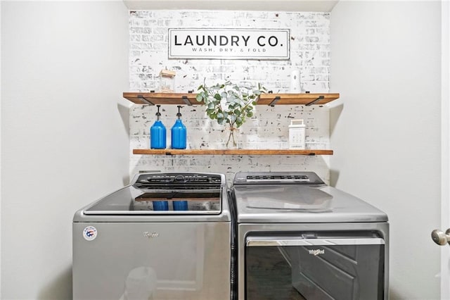 clothes washing area featuring laundry area and independent washer and dryer