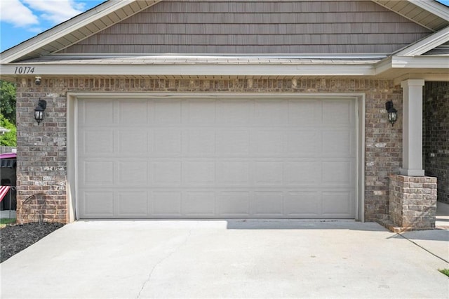 garage with concrete driveway