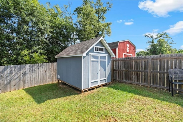 view of shed with a fenced backyard