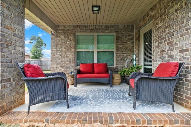 view of patio with fence and an outdoor living space