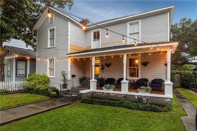 view of front of house featuring a front yard and a porch