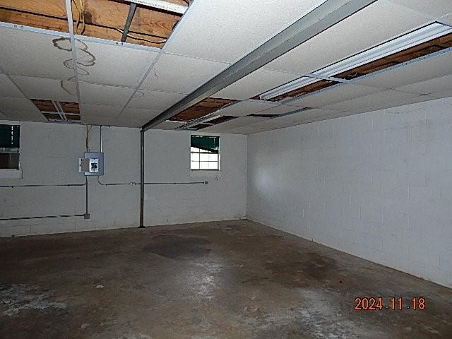 basement featuring electric panel