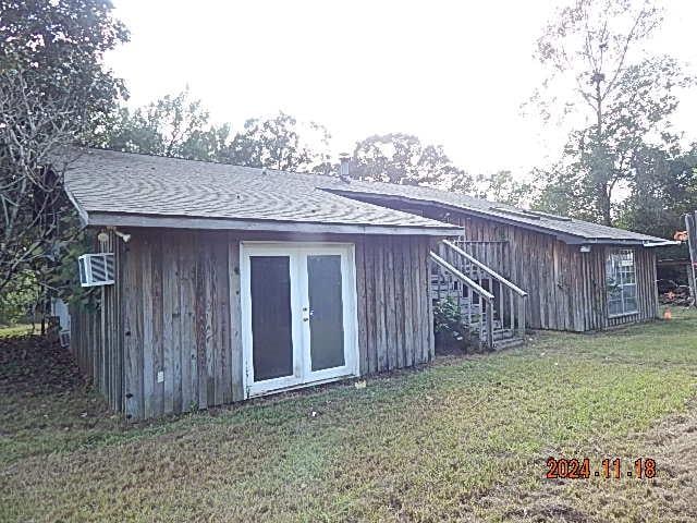 view of outbuilding with a lawn