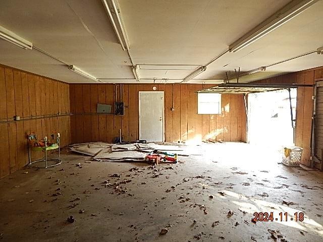 miscellaneous room with wooden walls