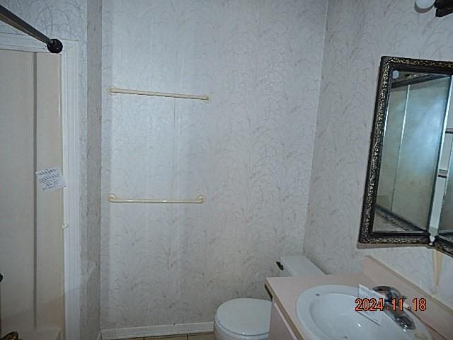 bathroom with vanity and toilet