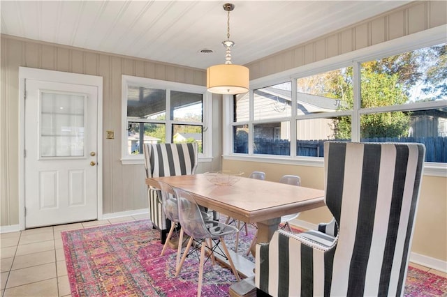 dining space featuring plenty of natural light, light tile patterned floors, and wooden ceiling